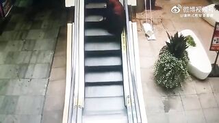 Old Woman Falls And Cannot Climb The Escalator