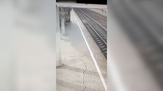 An Old Woman Lies On The Tracks In Front Of A Train 