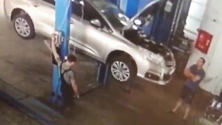 Car Falls From Elevator Onto Shop Worker 