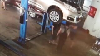 Car Falls From Elevator Onto Shop Worker 