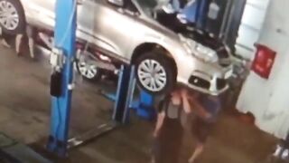 Car Falls From Elevator Onto Shop Worker 