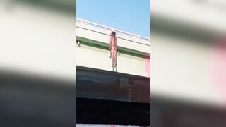 Dead Man Hanging On Bridge Railing 