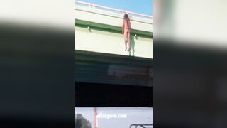 Dead Man Hanging On Bridge Railing 