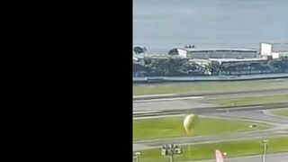 Large Balloon Filled With Fireworks Lands On Plane - Video