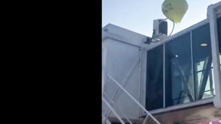 Large Balloon Filled With Fireworks Lands On Plane - Video