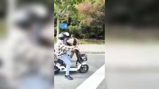 A Man Cuts A Woman's Throat On The Street. China 