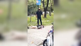 A Man Cuts A Woman's Throat On The Street. China 