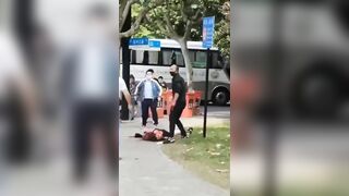 A Man Cuts A Woman's Throat On The Street. China 