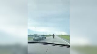 Biker Loses The Race 