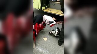 Motorcyclist's Head Crushed By Bus Wheels 