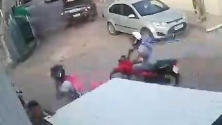 Pedestrian Hits Motorcyclist In The Head With Rock 