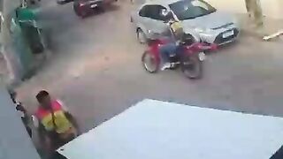 Pedestrian Hits Motorcyclist In The Head With Rock 