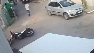 Pedestrian Hits Motorcyclist In The Head With Rock 