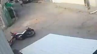 Pedestrian Hits Motorcyclist In The Head With Rock 