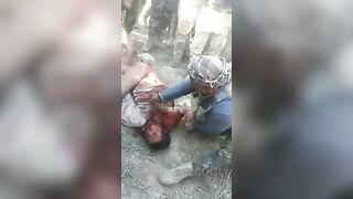 Soldiers From An Unknown Army Cut A Prisoner's Throat 