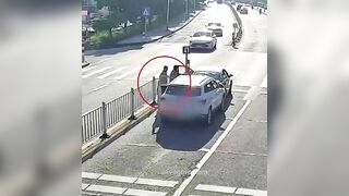 Driver Hit While Getting Out Of Car On Street