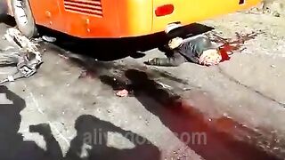 The Wheel Of A Bus Splits The Motorcyclist In Half 