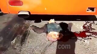 The Wheel Of A Bus Splits The Motorcyclist In Half 
