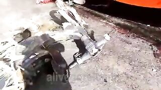 The Wheel Of A Bus Splits The Motorcyclist In Half 