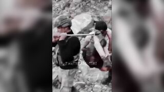 Turkish Soldiers Carry Broken Body Of PKK Fighter