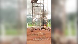 Two Workers Were Electrocuted When They Pushed The Tower To Collapse.