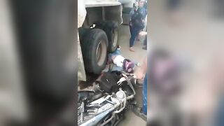 Motorcyclist Run Over By Truck Tire 