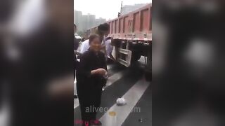 Woman Riding Scooter Under Truck Wheel 