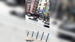 A Cyclist Without A Helmet Knocked Down Another Cyclist At An Intersection-01