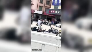 A Cyclist Without A Helmet Knocked Down Another Cyclist At An Intersection-01