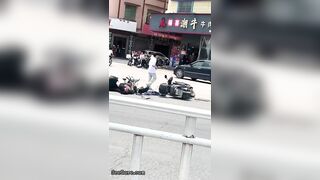 A Cyclist Without A Helmet Knocked Down Another Cyclist At An Intersection-01