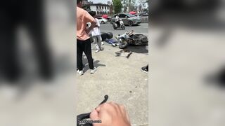 Bicyclist Without Helmet Knocks Down Other Cyclist At Intersection