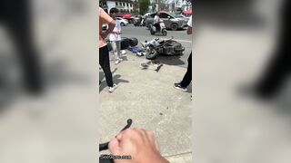Bicyclist Without Helmet Knocks Down Other Cyclist At Intersection
