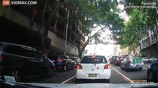 A Delivery Driver On A Scooter Crashed Straight Into An Open Car Door