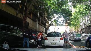 A Delivery Driver On A Scooter Crashed Straight Into An Open Car Door