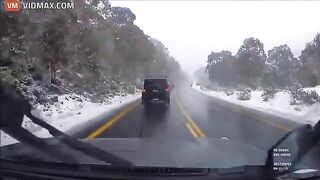 Driver Crashes While Overtaking In Snowfall - Video