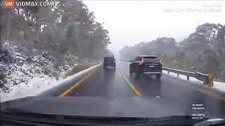 Driver Crashes While Overtaking In Snowfall - Video
