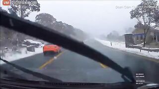 Driver Crashes While Overtaking In Snowfall - Video