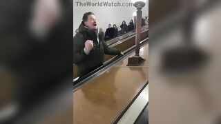 Drunk Russian Stops Escalator