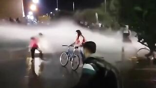 Protesters Defend Themselves With Water Cannons