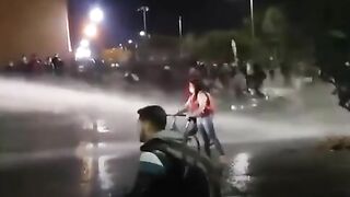 Protesters Defend Themselves With Water Cannons