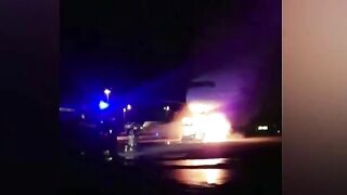 Firefighters Battle To Save Plane As Truck Tows Away Passenger Jet