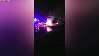 Firefighters Battle To Save Plane As Truck Tows Away Passenger Jet