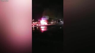 Firefighters Battle To Save Plane As Truck Tows Away Passenger Jet