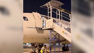 Ground Crew Dismantling Stairs