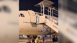 Ground Crew Dismantling Stairs