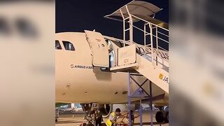 Ground Crew Dismantling Stairs