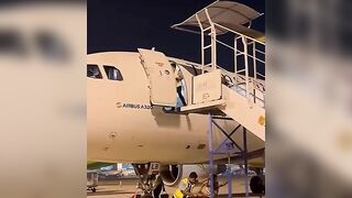 Ground Crew Dismantling Stairs