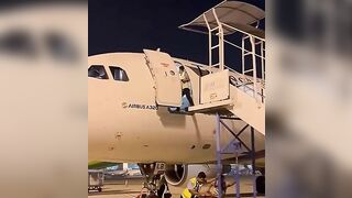 Ground Crew Dismantling Stairs