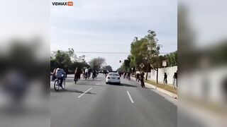 Man Drives Mercedes Through Crowd Of Punks Blocking Street