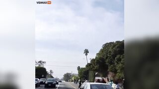 Man Drives Mercedes Through Crowd Of Punks Blocking Street